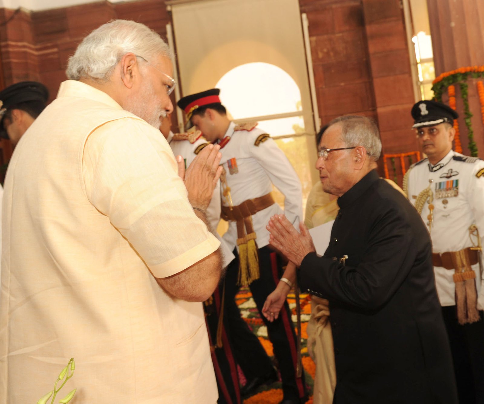 The President, Pranab Mukherjee being welcomed by the Prime Minister, Narendra Modi on his arrival at parliament house to attend the joint session of the parliament, in New Delhi on June 09, 2014.