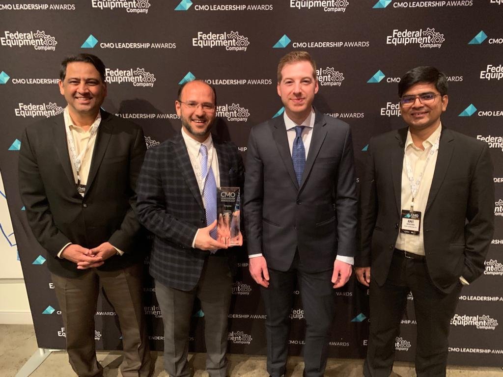 Ashu Tandon (with the trophy), Chief Commercial Officer, Syngene International Ltd., with the organiser (2nd from right) and Syngene team members (gentlemen on either ends)