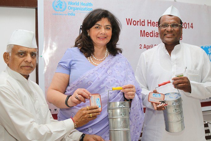 Dr. Nata Menabde, WHO Representative to India and Mr. Raghunath Medge, Ex-President, Nutan Mumbai Tiffin Box Suppliers Charity Trust (right) with one of his associates