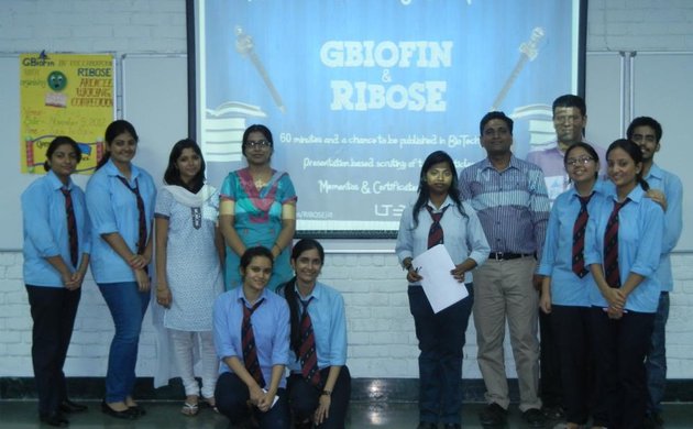 Team GBIOFIN with the students at an event!