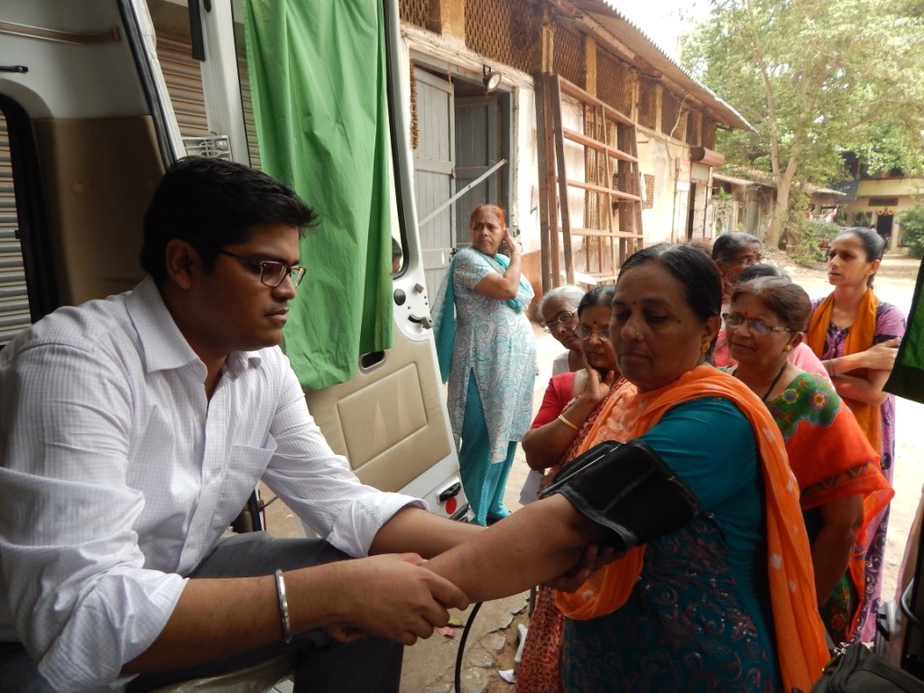 Doctors conducting health screening on slum dwellers